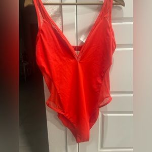 Red bathing suit v neck slight high cut a see through sides